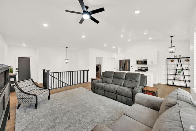 88 N Maraschino W, Grantsville, UT 84029 - living room with light wood finished floors, a ceiling fan, recessed lighting, lofted ceiling, and washer / clothes dryer