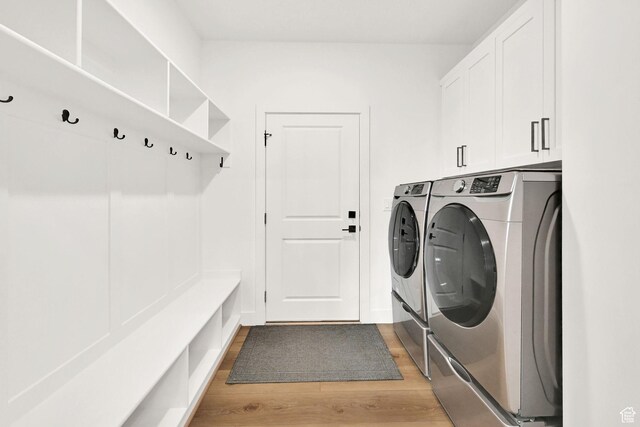 88 N Maraschino W, Grantsville, UT 84029 - washroom featuring separate washer and dryer, light wood-style floors, and cabinet space