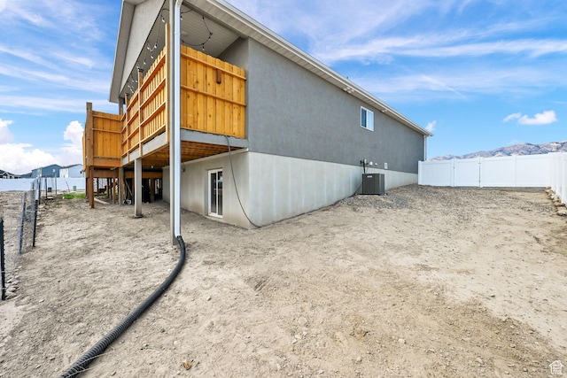 88 N Maraschino W, Grantsville, UT 84029 - rear view of property with a wooden deck and stucco siding