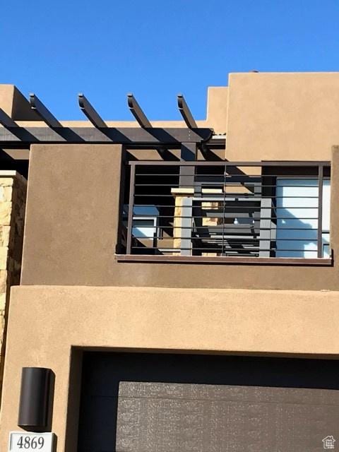 4895 N Fishers Island Way, St George, UT 84770 - view of home's exterior featuring a balcony and stucco siding