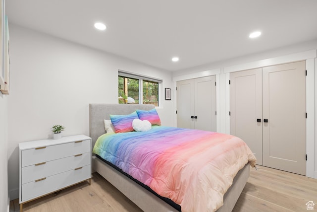 5223 S Hillsden Dr, Holladay, UT 84117 - bedroom featuring two closets, light wood finished floors, and recessed lighting