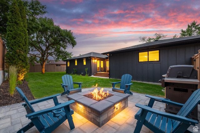 5223 S Hillsden Dr, Holladay, UT 84117 - patio terrace at dusk featuring a fire pit and a patio