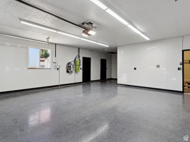 2203 N Joni Dr E, Layton, UT 84040 - garage with a garage door opener and baseboards