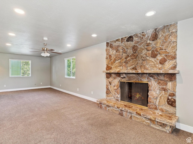2203 N Joni Dr E, Layton, UT 84040 - unfurnished living room with carpet flooring, plenty of natural light, a fireplace, and recessed lighting