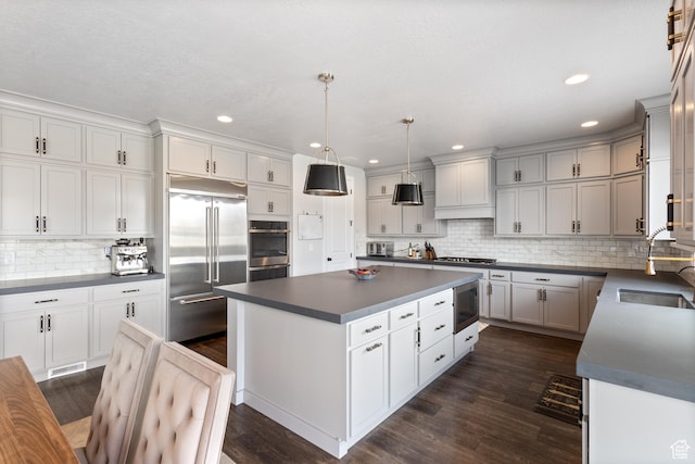 3862 W Lucerne Way, Lehi, UT 84043 - kitchen featuring built in appliances, dark countertops, backsplash, a center island, and recessed lighting