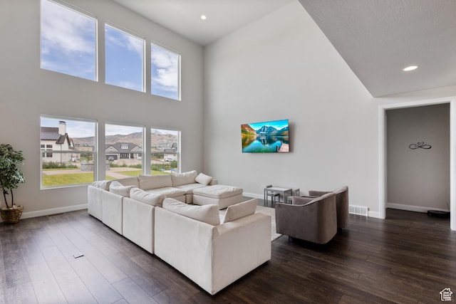 3862 W Lucerne Way, Lehi, UT 84043 - living room featuring dark wood-style flooring, a high ceiling, and recessed lighting