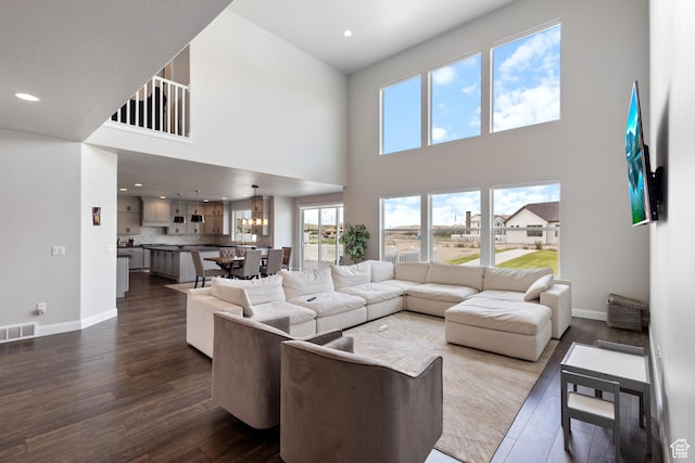 3862 W Lucerne Way, Lehi, UT 84043 - living room featuring dark wood-style floors, recessed lighting, and a high ceiling