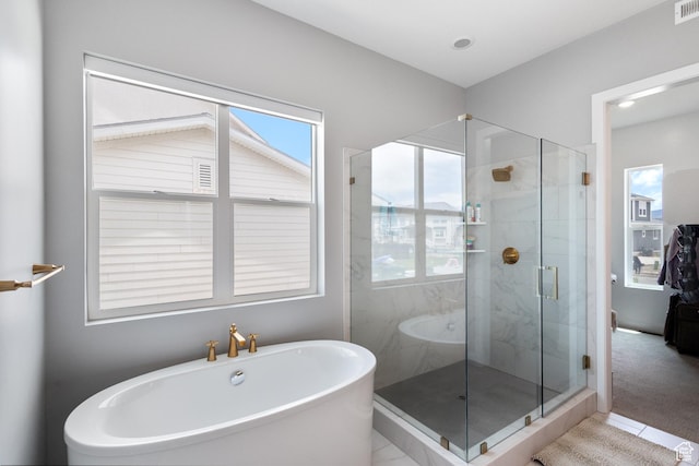 3862 W Lucerne Way, Lehi, UT 84043 - bathroom with plenty of natural light, a soaking tub, a shower stall, tile patterned flooring, and recessed lighting