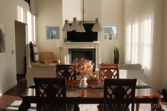 5071 N Oak Creek Dr, Eagle Mountain, UT 84005 - dining space featuring wood finished floors and a glass covered fireplace
