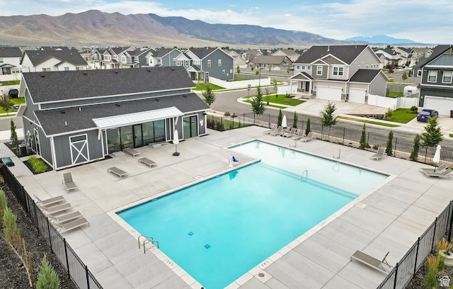 5071 N Oak Creek Dr, Eagle Mountain, UT 84005 - community pool featuring a residential view, a mountain view, and a patio