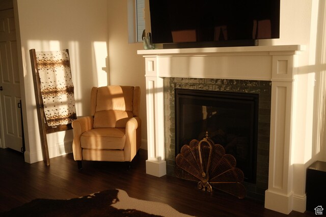 5071 N Oak Creek Dr, Eagle Mountain, UT 84005 - sitting room featuring dark wood-type flooring and a tiled fireplace