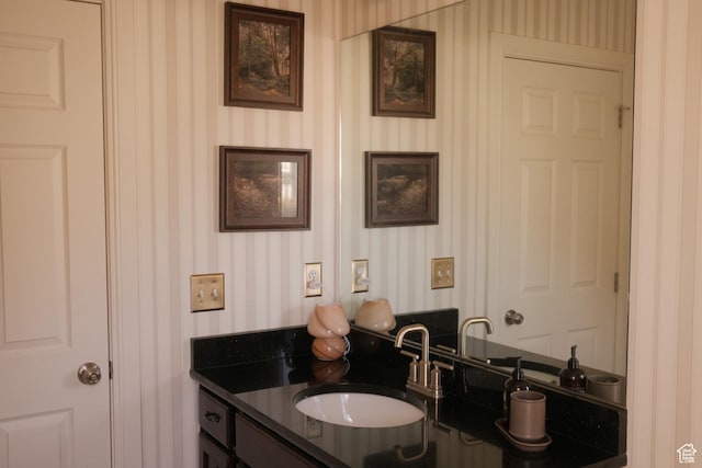 5071 N Oak Creek Dr, Eagle Mountain, UT 84005 - bathroom featuring vanity and wallpapered walls