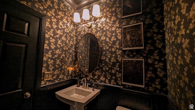 5071 N Oak Creek Dr, Eagle Mountain, UT 84005 - bathroom with wallpapered walls, crown molding, and wainscoting