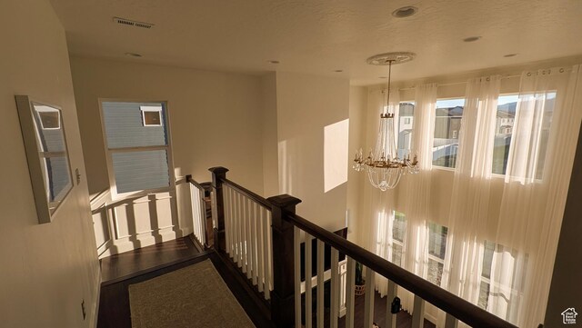 5071 N Oak Creek Dr, Eagle Mountain, UT 84005 - hallway featuring an upstairs landing and a chandelier