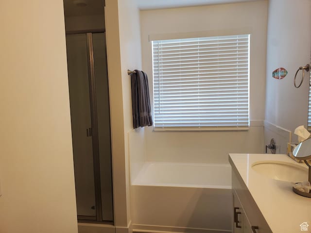 1082 E Springwater Way Unit 812, Eagle Mountain, UT 84005 - full bathroom featuring a stall shower, vanity, and a garden tub