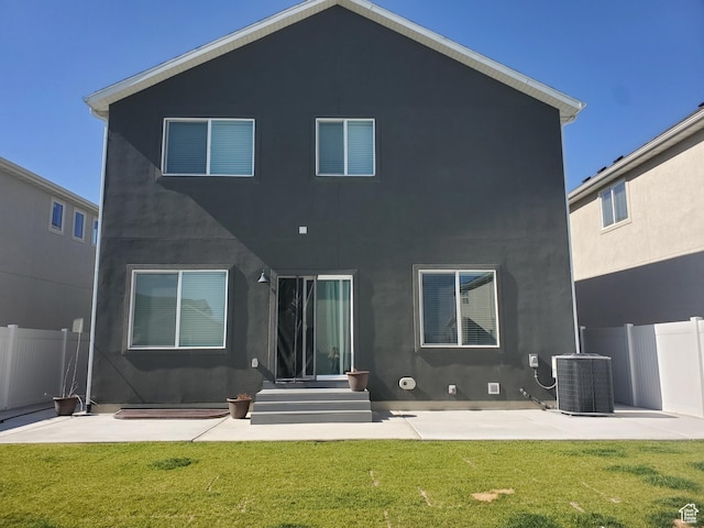 1082 E Springwater Way Unit 812, Eagle Mountain, UT 84005 - rear view of property featuring a patio, stucco siding, and entry steps