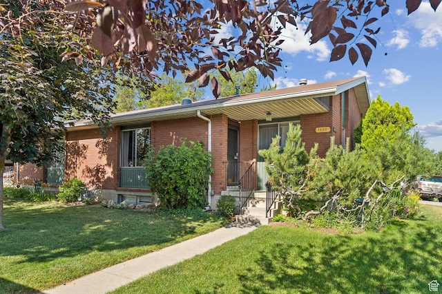 6112 S Vineway Cir E, Salt Lake City, UT 84121 - ranch-style home with brick siding and a front lawn