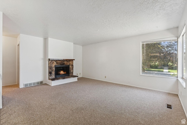 6113 S Vineway Cir, Salt Lake City, UT 84121 - unfurnished living room featuring carpet, a textured ceiling, and a fireplace