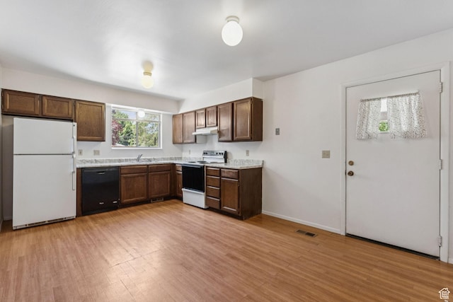 6113 S Vineway Cir, Salt Lake City, UT 84121 - kitchen featuring white appliances, under cabinet range hood, light countertops, and light wood-style floors