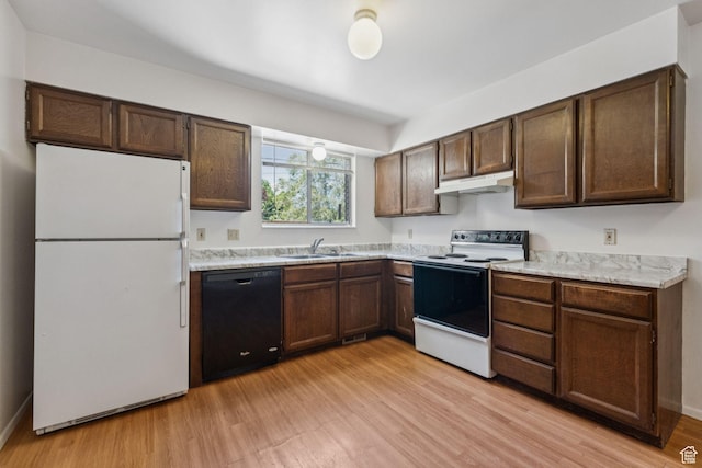 6113 S Vineway Cir, Salt Lake City, UT 84121 - kitchen with white appliances, under cabinet range hood, light wood-style floors, and light countertops