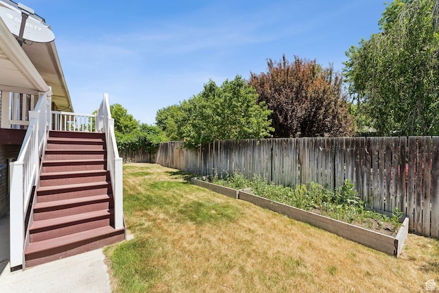 6133 S Vineway Cir, Salt Lake City, UT 84121 - fenced backyard with stairs, a vegetable garden, and a wooden deck