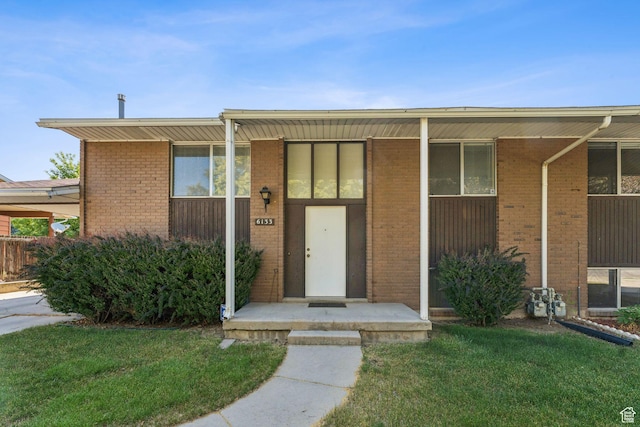 6133 S Vineway Cir, Salt Lake City, UT 84121 - view of front facade with brick siding and a front yard