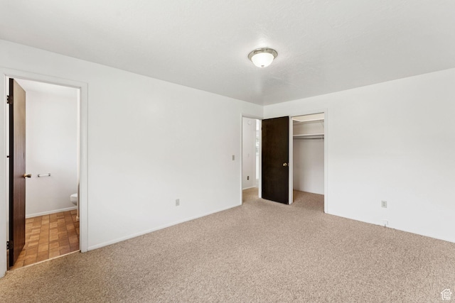 6133 S Vineway Cir, Salt Lake City, UT 84121 - unfurnished bedroom featuring light carpet, a closet, and connected bathroom