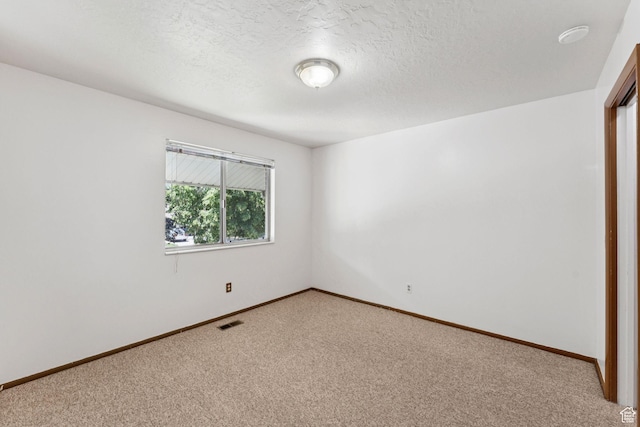 6133 S Vineway Cir, Salt Lake City, UT 84121 - empty room with light carpet and a textured ceiling