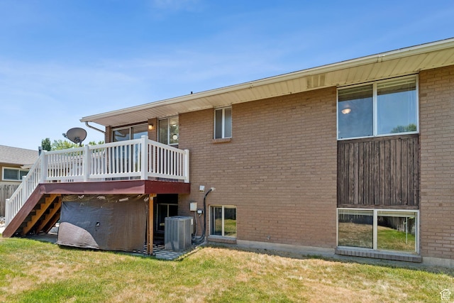 6133 S Vineway Cir, Salt Lake City, UT 84121 - rear view of house with a deck, stairway, brick siding, and a lawn