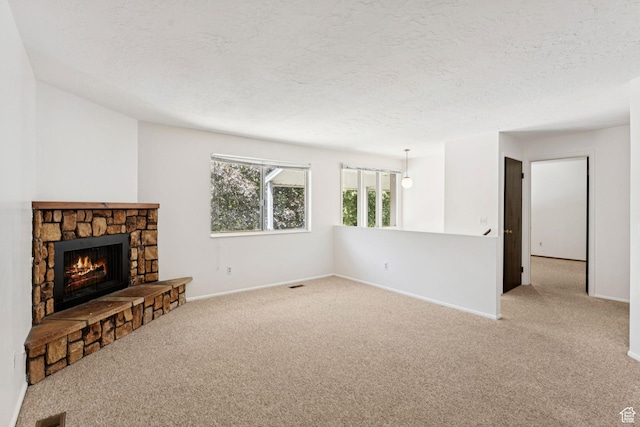 6133 S Vineway Cir, Salt Lake City, UT 84121 - unfurnished living room featuring carpet flooring, a fireplace, and a textured ceiling