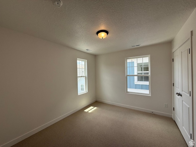 6923 W S Jordan Pkwy S, South Jordan, UT 84009 - unfurnished bedroom featuring light carpet and a textured ceiling