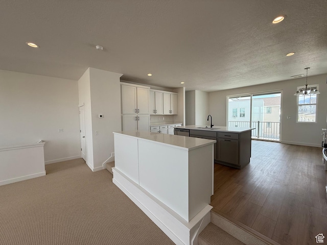 6923 W S Jordan Pkwy S, South Jordan, UT 84009 - kitchen featuring a center island with sink, recessed lighting, light countertops, dishwasher, and pendant lighting