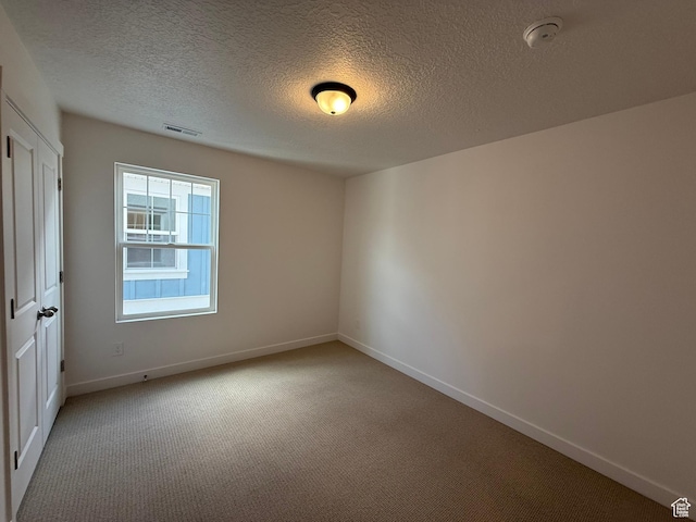 6923 W S Jordan Pkwy S, South Jordan, UT 84009 - carpeted spare room featuring a smoke detector and a textured ceiling
