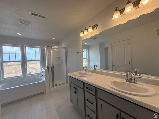 6923 W S Jordan Pkwy S, South Jordan, UT 84009 - full bath with a shower stall, a garden tub, double vanity, a textured ceiling, and marble look tiles