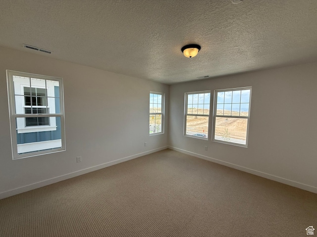 6923 W S Jordan Pkwy S, South Jordan, UT 84009 - unfurnished room with a textured ceiling and carpet flooring
