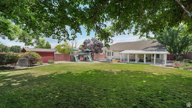 6320 S Hathaway St, Taylorsville, UT 84123 - fenced backyard featuring a playground and a patio