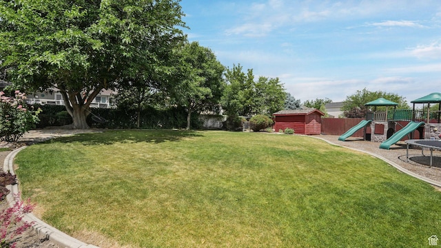 6320 S Hathaway St, Taylorsville, UT 84123 - fenced backyard featuring a storage shed and a playground
