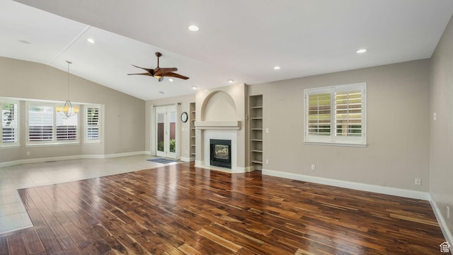 6320 S Hathaway St, Taylorsville, UT 84123 - unfurnished living room featuring wood-type flooring, a fireplace with flush hearth, ceiling fan, built in shelves, and recessed lighting