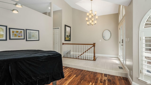 6320 S Hathaway St, Taylorsville, UT 84123 - entrance foyer with dark wood-style flooring, a chandelier, and high vaulted ceiling