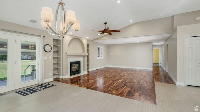 6320 S Hathaway St, Taylorsville, UT 84123 - unfurnished living room featuring vaulted ceiling, ceiling fan, built in features, wood finished floors, and a chandelier