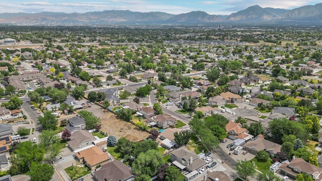 6320 S Hathaway St, Taylorsville, UT 84123 - aerial overview of property's location featuring mountains and nearby suburban area
