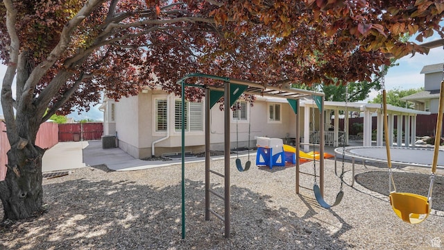 6320 S Hathaway St, Taylorsville, UT 84123 - back of house with a trampoline