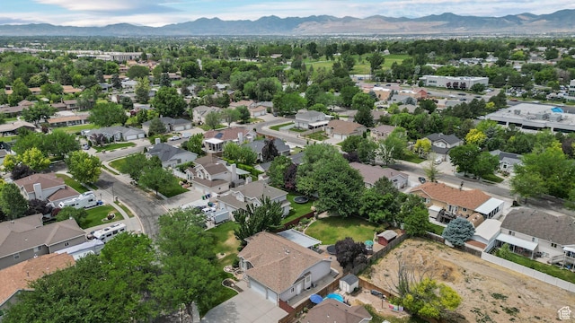 6320 S Hathaway St, Taylorsville, UT 84123 - aerial view of property and surrounding area featuring a mountainous background and nearby suburban area