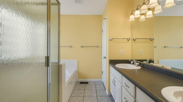 6320 S Hathaway St, Taylorsville, UT 84123 - bathroom with a stall shower, a bath, double vanity, and tile patterned flooring