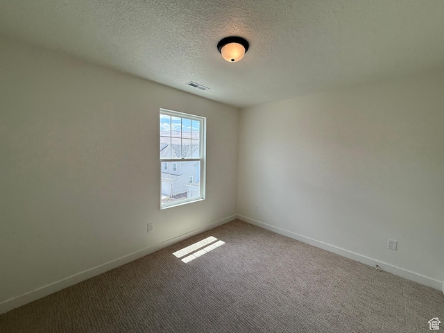 6921 W S Jordan Pkwy Unit 310, South Jordan, UT 84009 - empty room with carpet floors and a textured ceiling