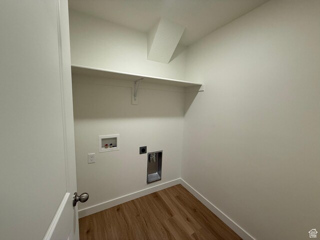 6921 W S Jordan Pkwy Unit 310, South Jordan, UT 84009 - washroom featuring wood finished floors, hookup for a washing machine, and hookup for an electric dryer