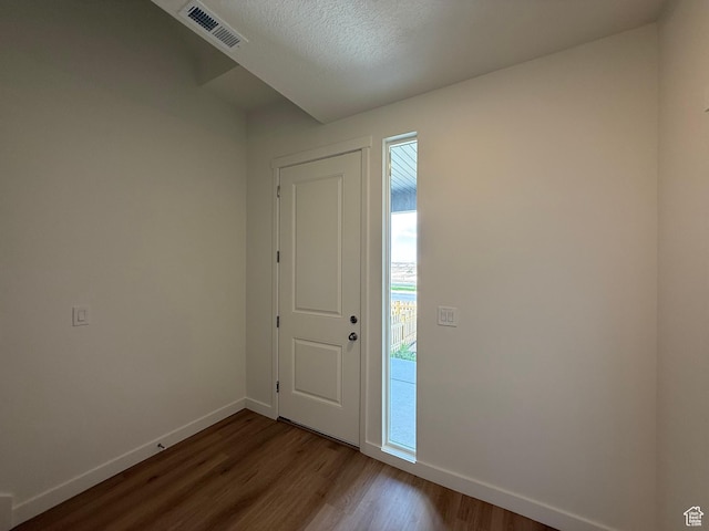6921 W S Jordan Pkwy Unit 310, South Jordan, UT 84009 - foyer featuring dark wood-style flooring and a textured ceiling