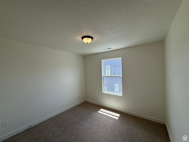 6921 W S Jordan Pkwy Unit 310, South Jordan, UT 84009 - carpeted empty room with baseboards and a textured ceiling