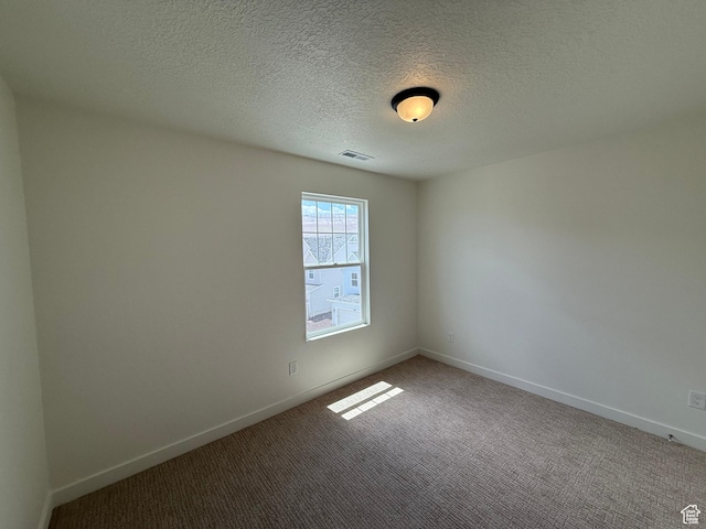 6921 W S Jordan Pkwy Unit 310, South Jordan, UT 84009 - carpeted empty room with baseboards and a textured ceiling