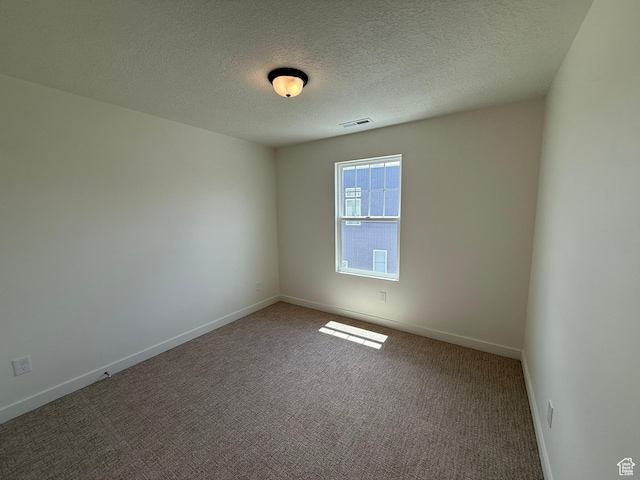 6921 W S Jordan Pkwy Unit 310, South Jordan, UT 84009 - carpeted empty room with baseboards and a textured ceiling